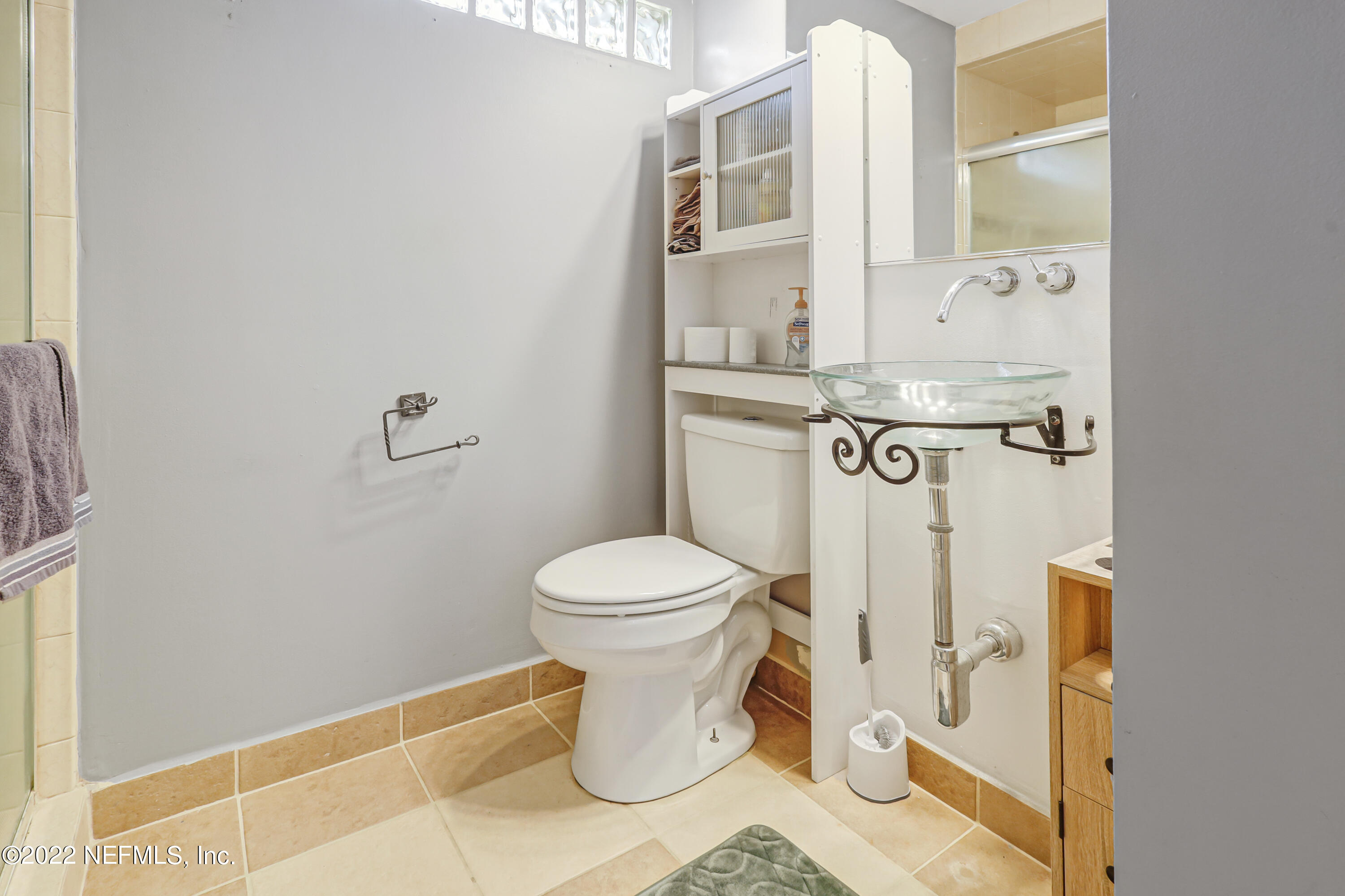 3955 Heidi Road Jacksonville, FL 32277 - Photo 31 of 43 a bathroom with a toilet and a shower