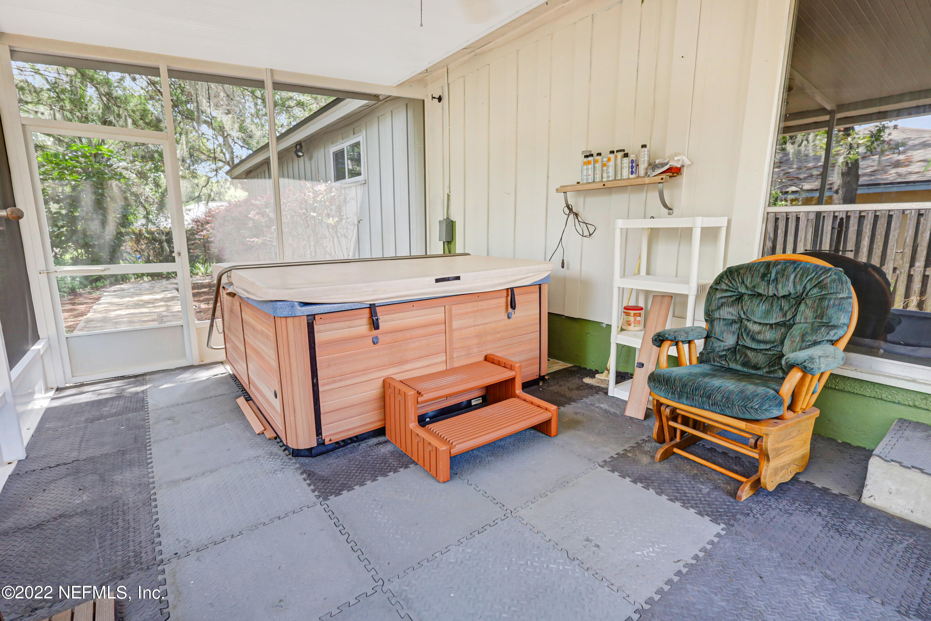 3955 Heidi Road Jacksonville, FL 32277 - Photo 38 of 43 a living room with furniture a flat screen tv and a window