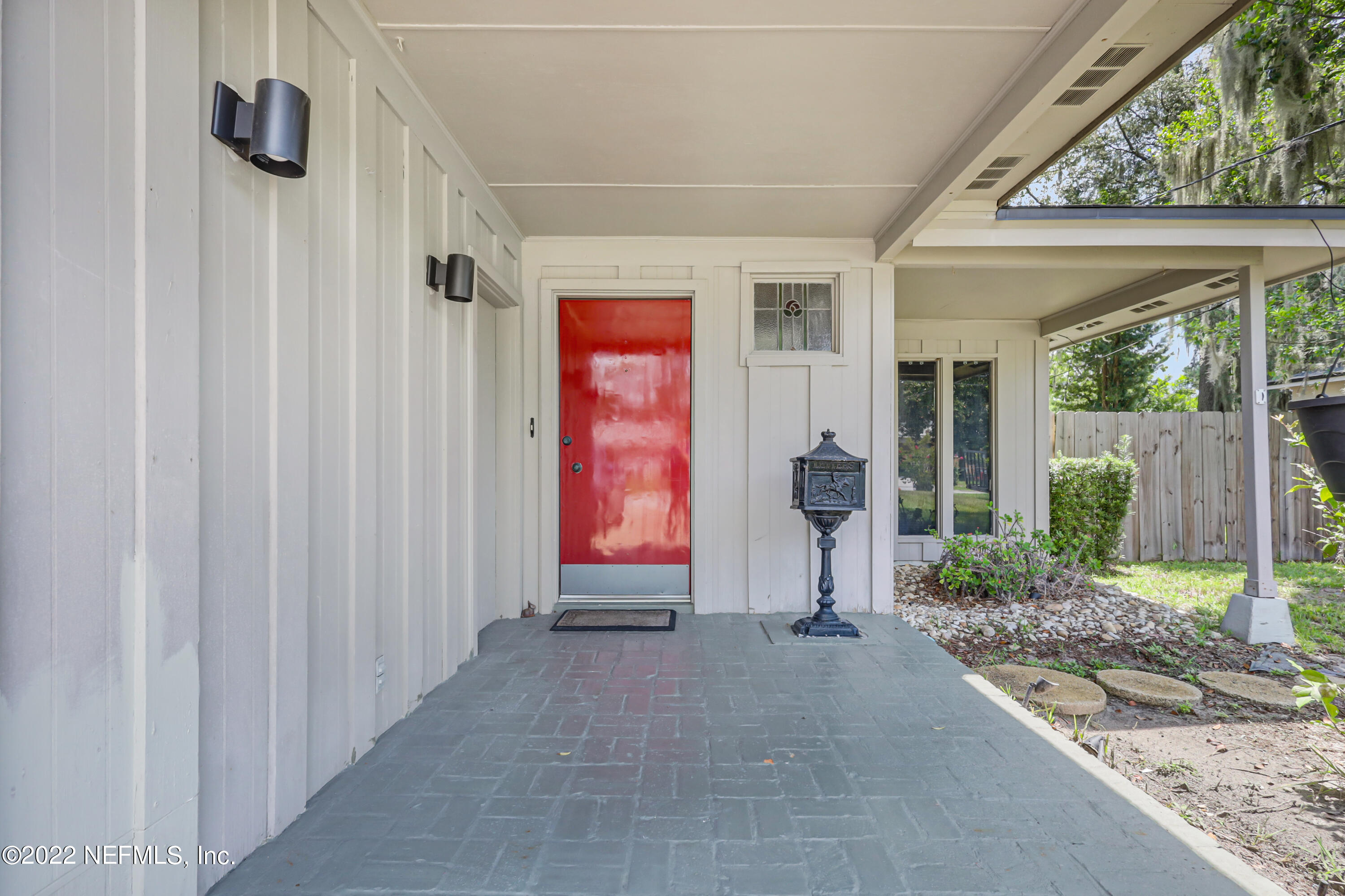 3955 Heidi Road Jacksonville, FL 32277 - Photo 4 of 43 a backyard of a house with seating space