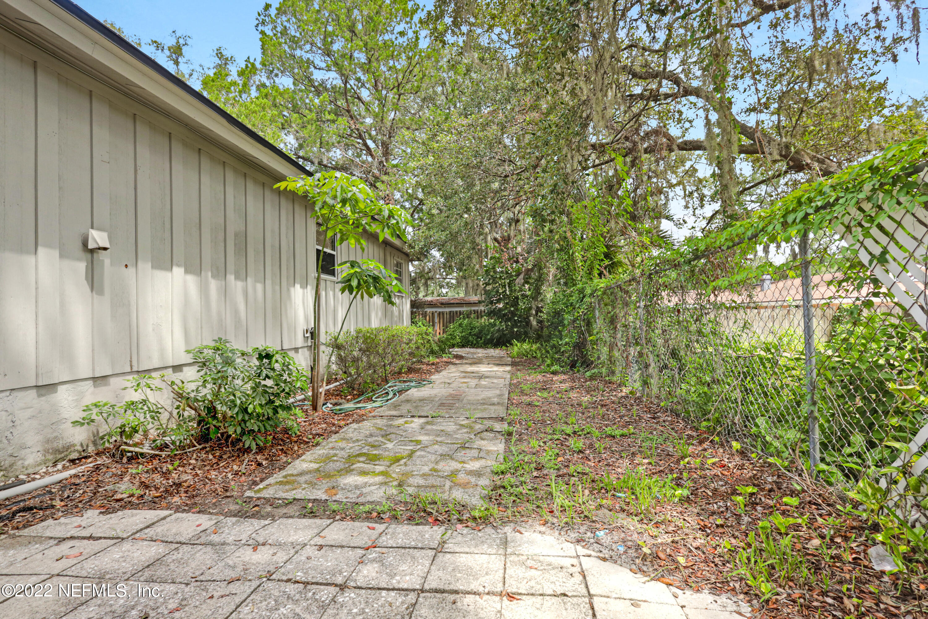 3955 Heidi Road Jacksonville, FL 32277 - Photo 41 of 43 a backyard of a house with lots of green space