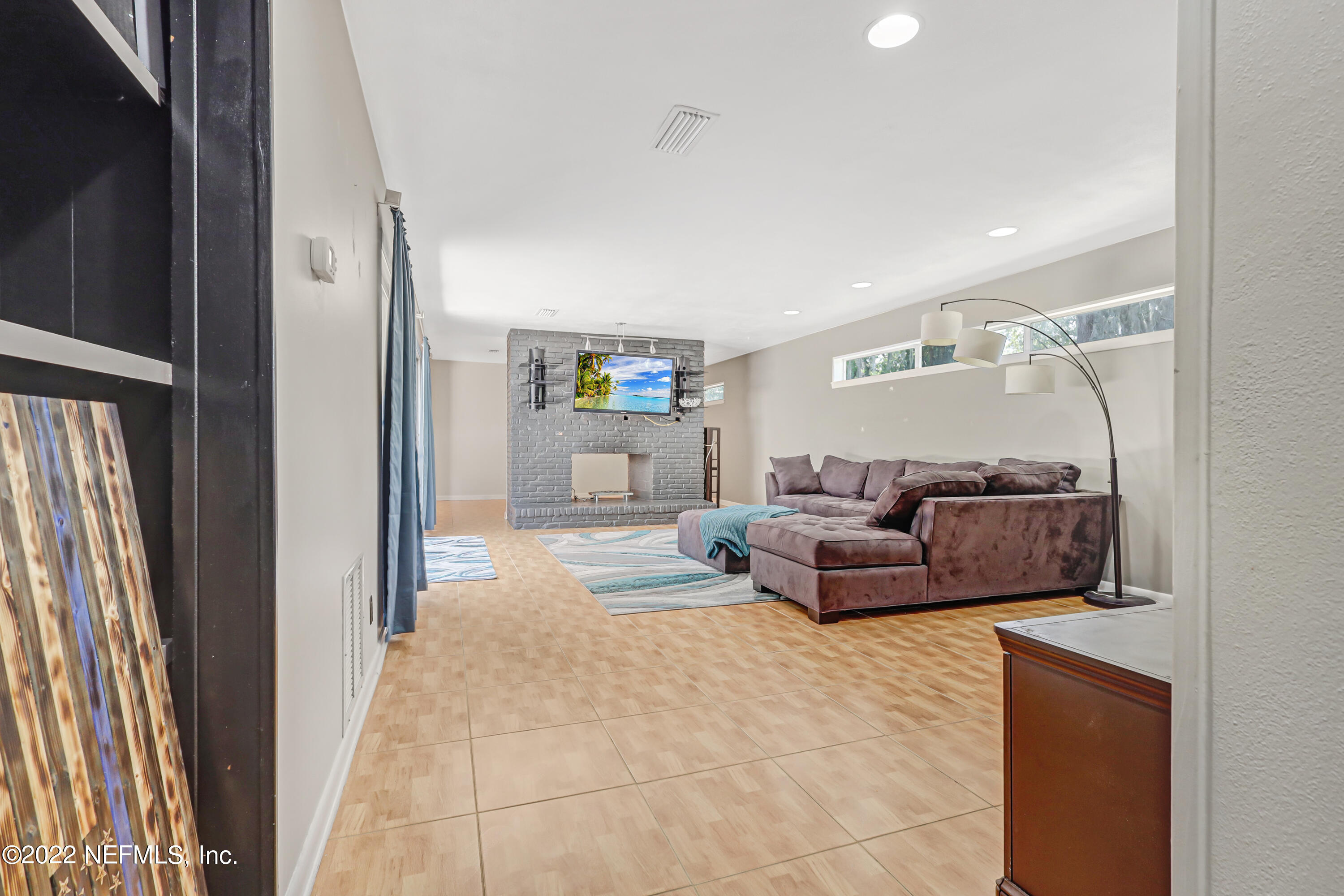 3955 Heidi Road Jacksonville, FL 32277 - Photo 9 of 43 a living room with furniture and a rug