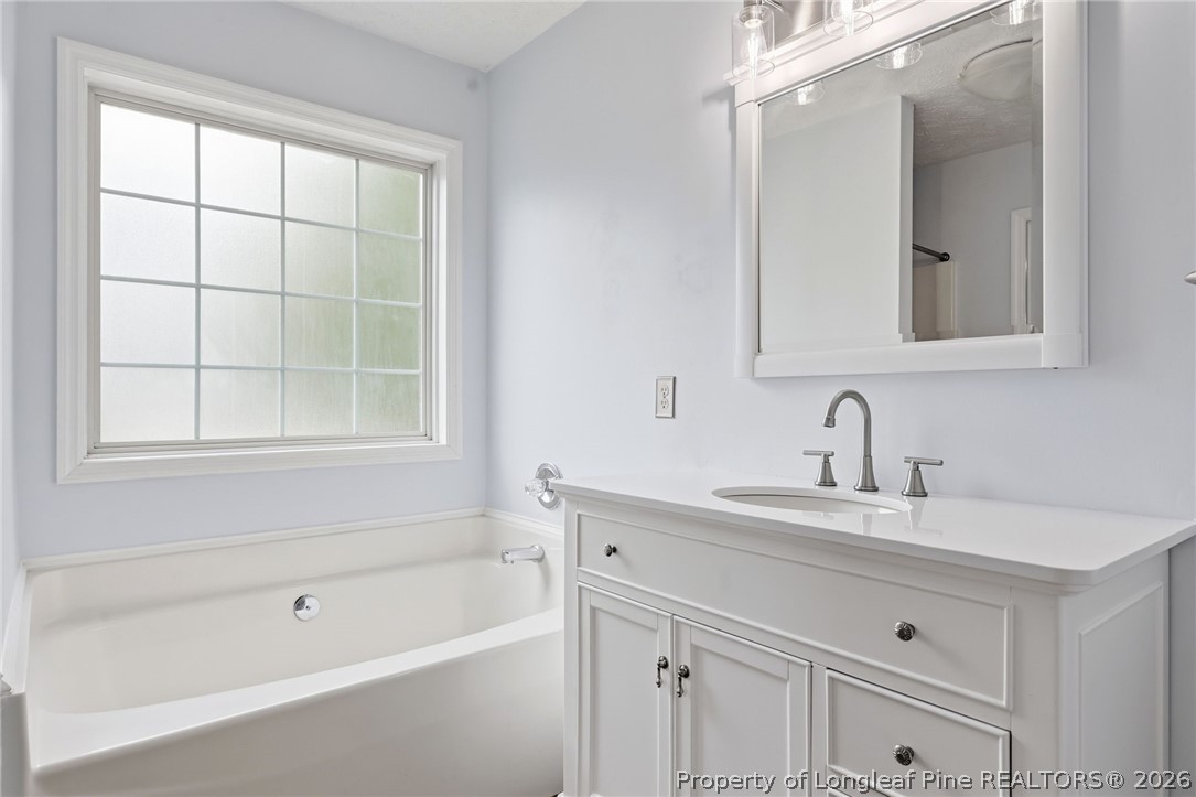 5113 Archer Road Hope Mills, NC 28348 - Photo 29 of 41 a bathroom with a sink and a bathtub
