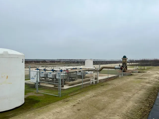 a view of a terrace with lawn chairs