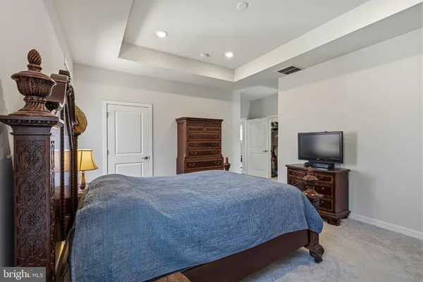 a spacious bathroom with a granite countertop sink a mirror and a