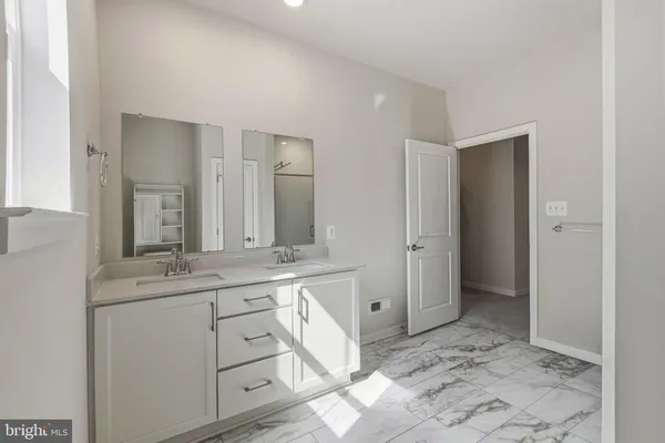 a bathroom with a shower and a sink