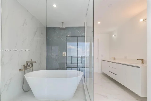 a bathroom with a bathtub and a sink