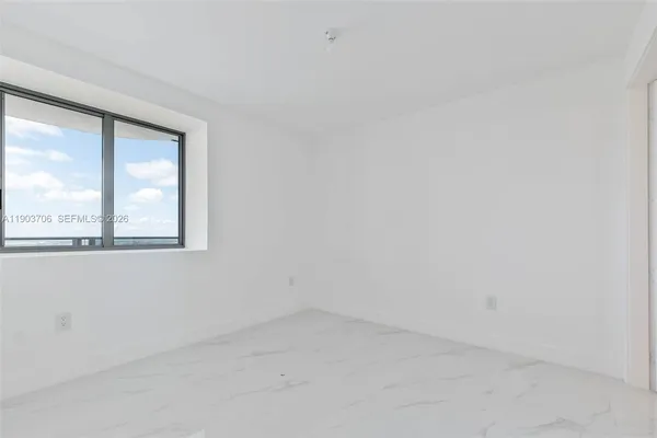 a bathroom with a toilet sink and shower