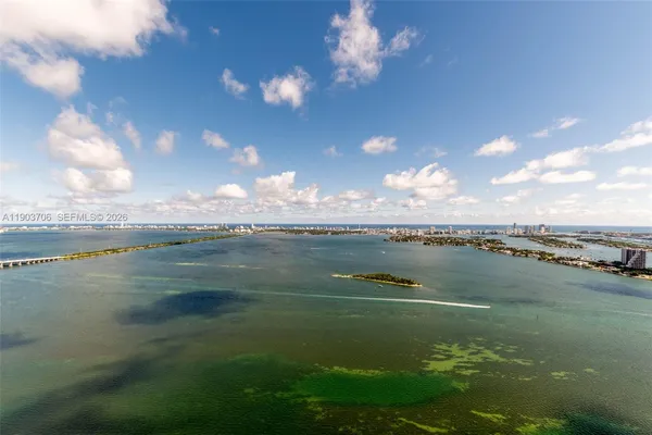 a view of lake with green space
