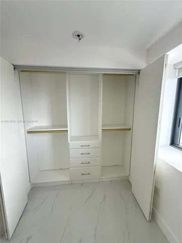 a view of water with city from a lake