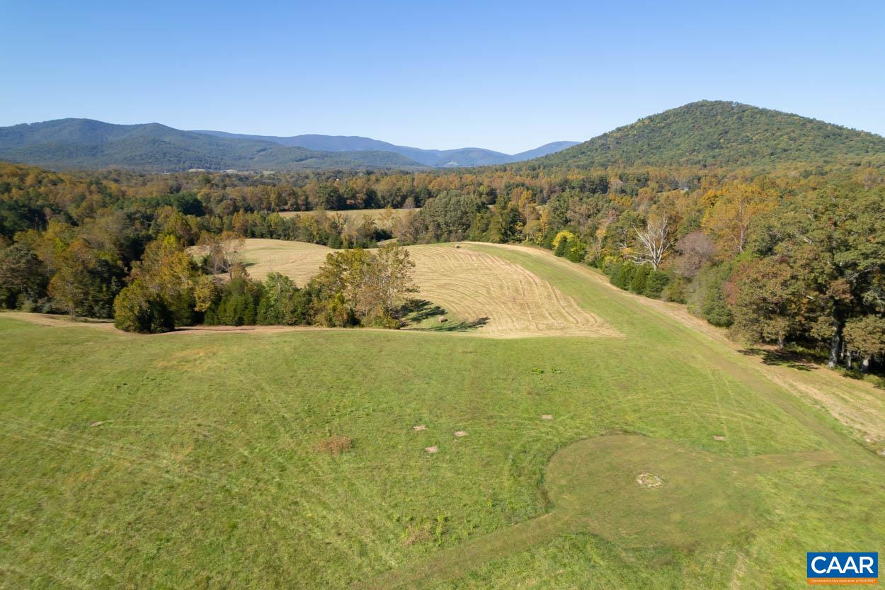 5080 Catterton Road Free Union, VA 22940 - Photo 4 of 35 a view of a field with mountains in the background