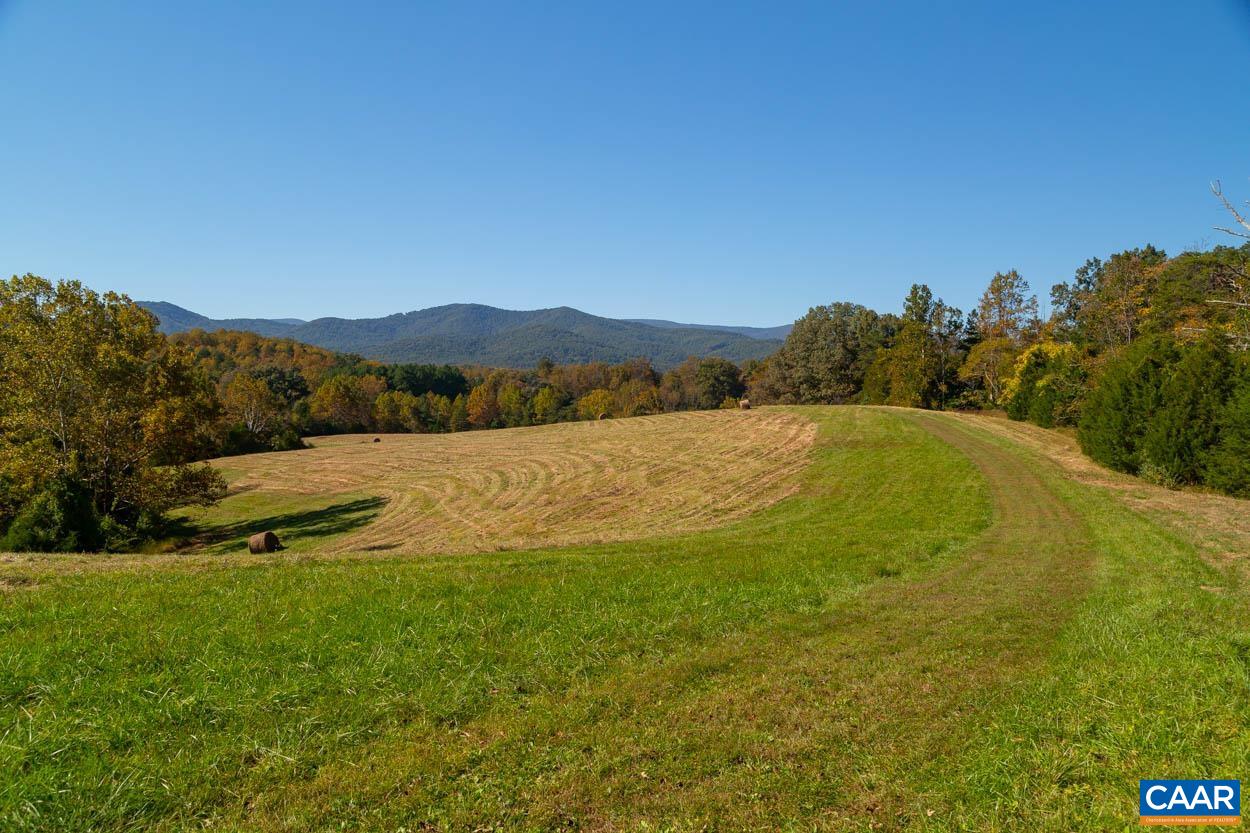 5080 Catterton Road Free Union, VA 22940 - Photo 8 of 35 a view of a lake with mountains in the background