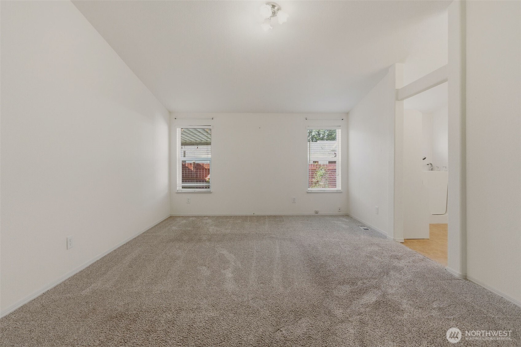 24036 222nd Avenue Southeast Maple Valley, WA 98038 - Photo 16 of 37 an empty room with windows