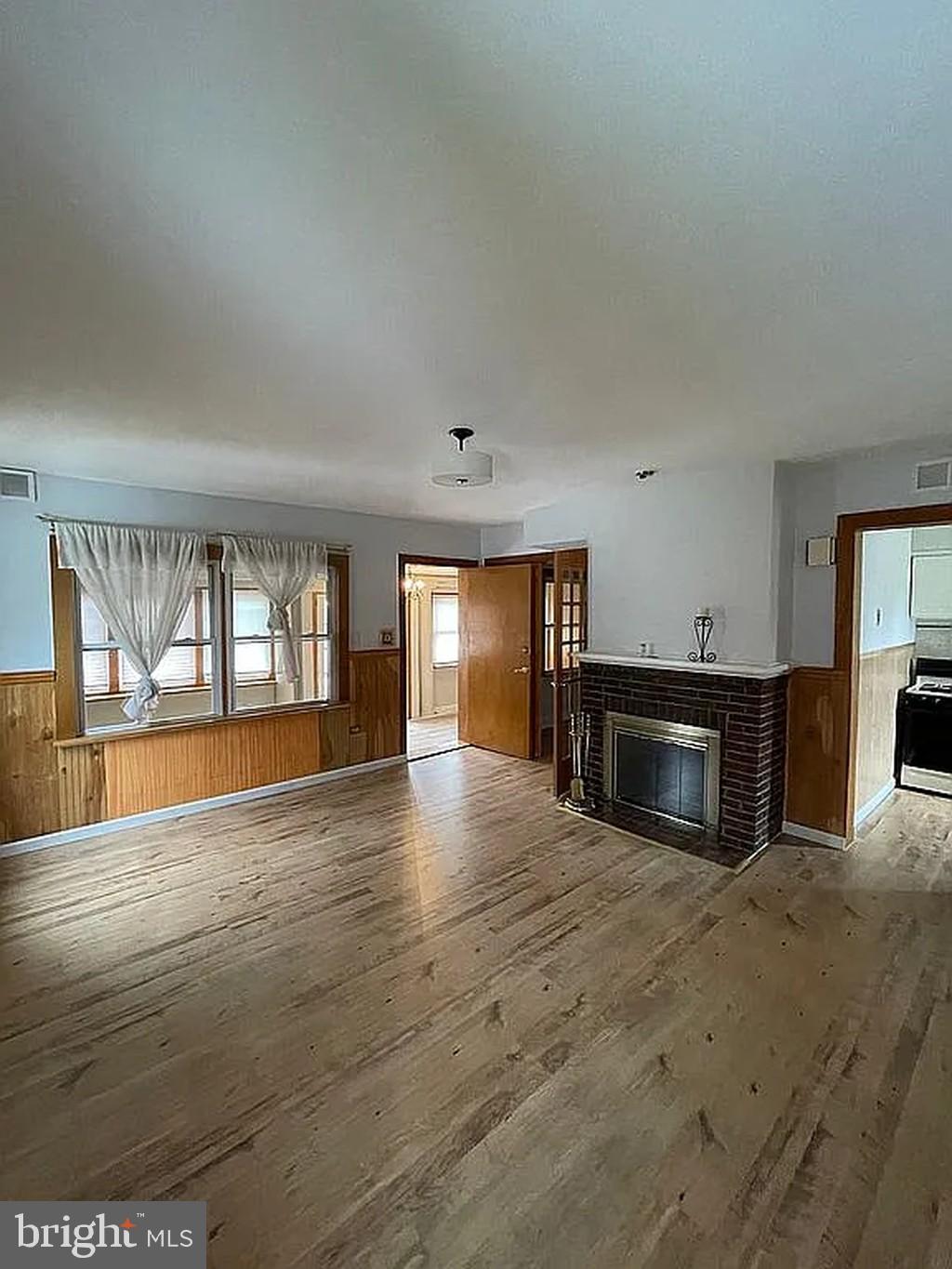 1715 Rhawn Street Philadelphia, PA 19111 - Photo 13 of 29 a view of an empty room with a fireplace and a window