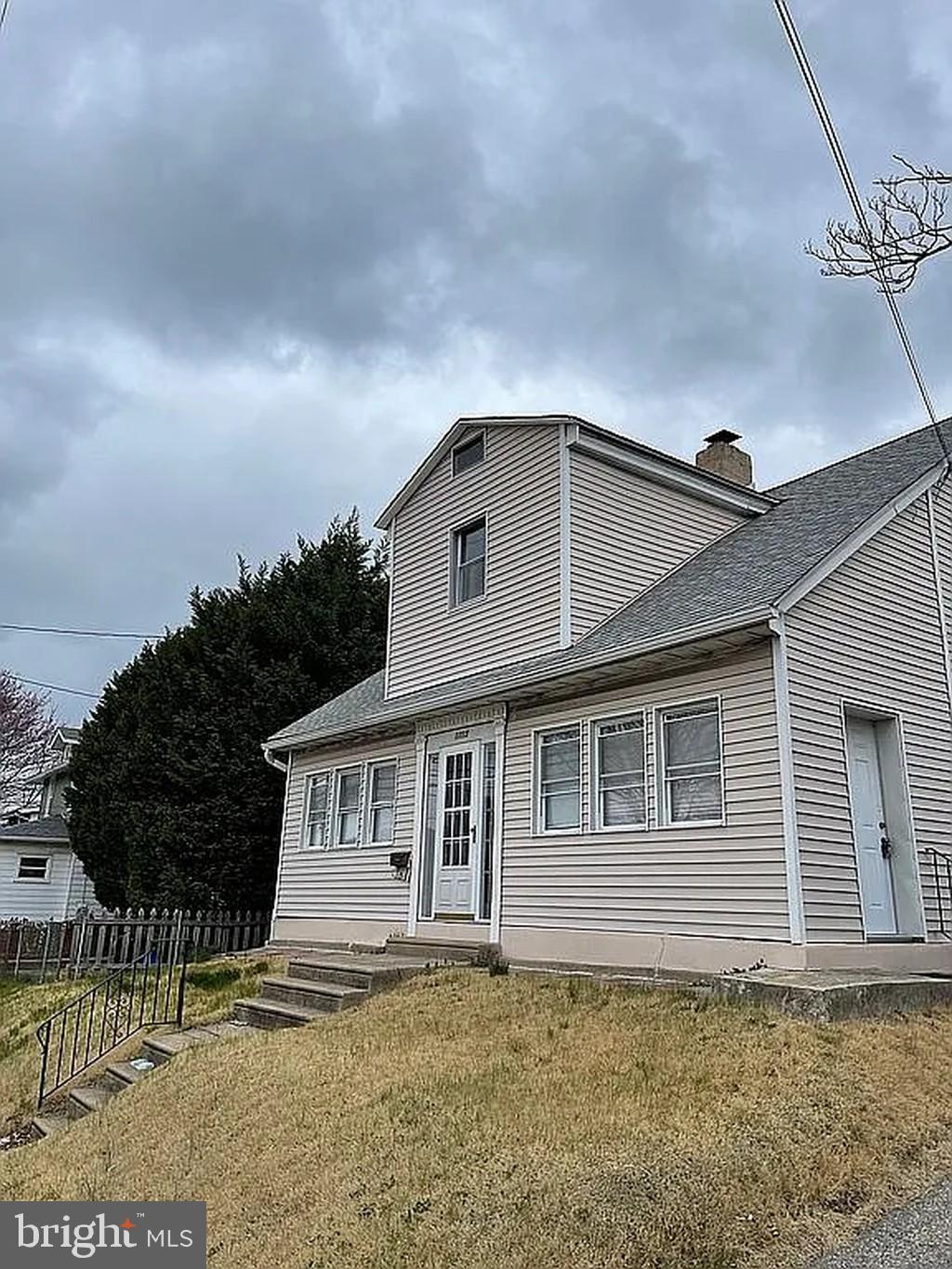 1715 Rhawn Street Philadelphia, PA 19111 - Photo 2 of 29 a front view of a house with a garden