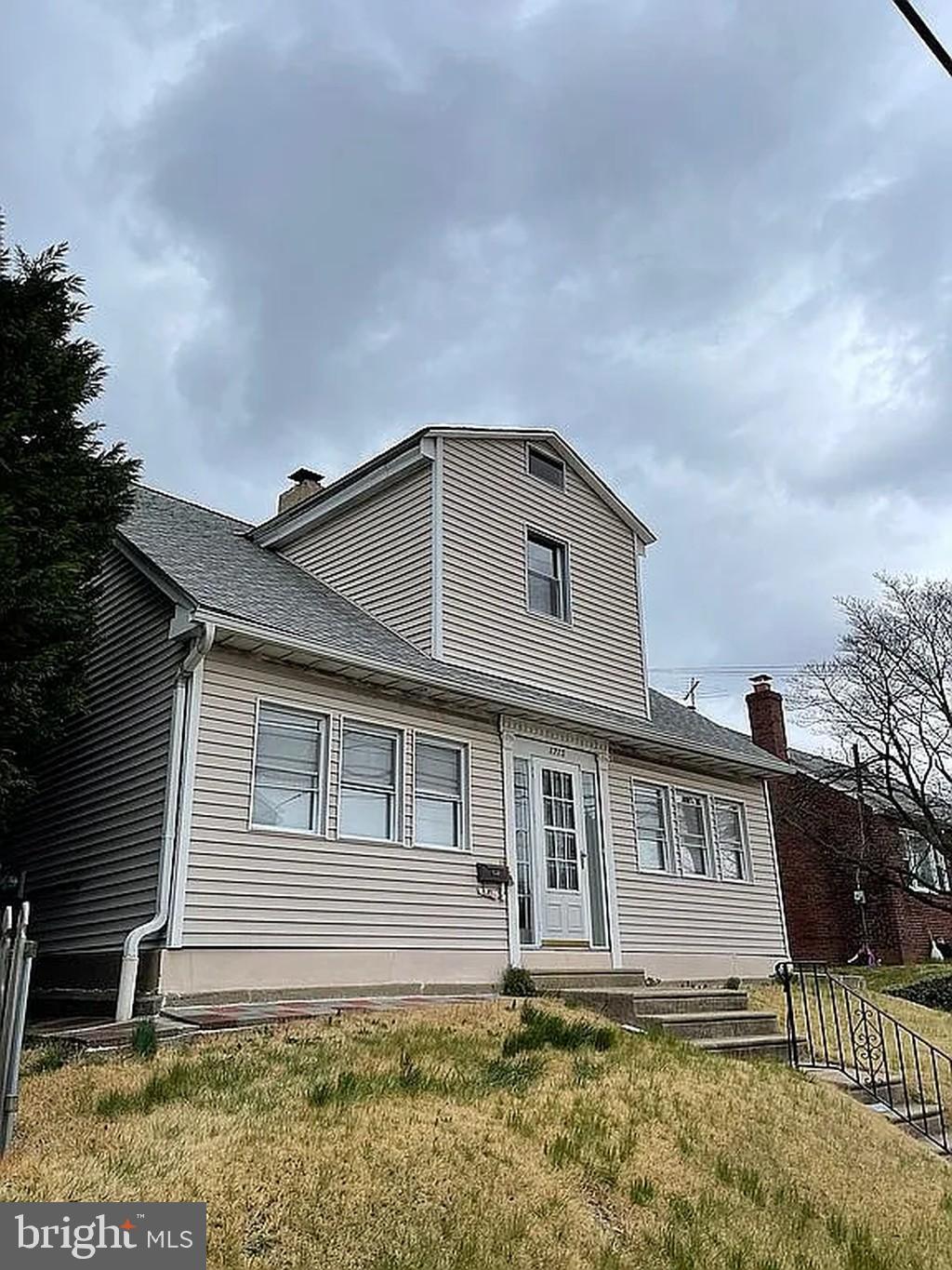 1715 Rhawn Street Philadelphia, PA 19111 - Photo 5 of 29 a front view of a house with a yard