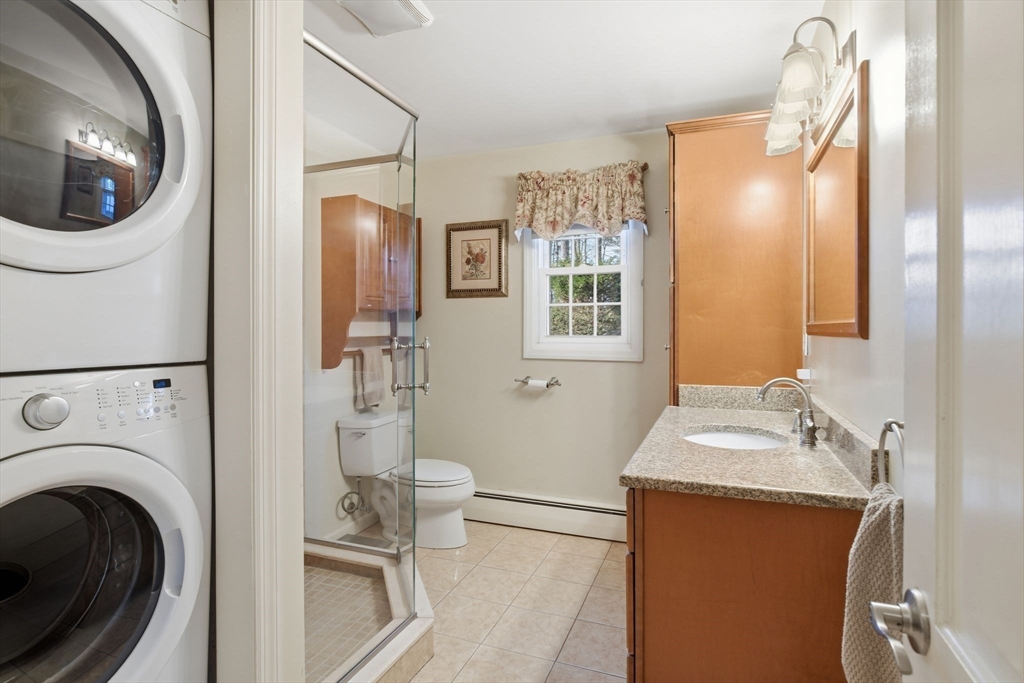 283 Forest Glen West Springfield, MA 01089 - Photo 15 of 40 a bathroom with a sink a toilet and a mirror