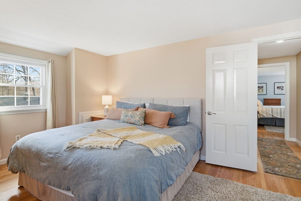 283 Forest Glen West Springfield, MA 01089 - Photo 21 of 40 a bedroom with a bed and a window