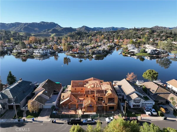 an aerial view of a house with mountain view