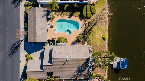 an aerial view of residential house with outdoor space and swimming pool