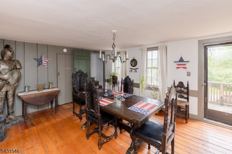 490 Mine Road Asbury, NJ 08802 - Photo 14 of 39 a view of a dining room with furniture window and wooden floor