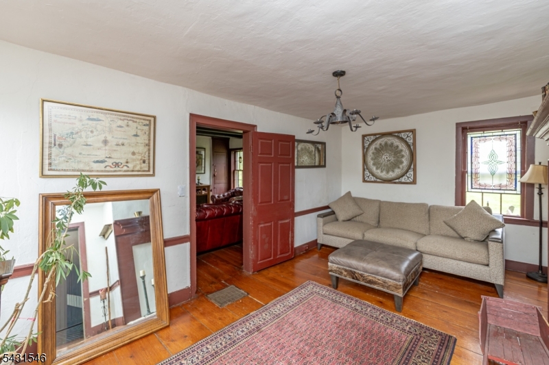 490 Mine Road Asbury, NJ 08802 - Photo 19 of 39 a living room with furniture and a chandelier