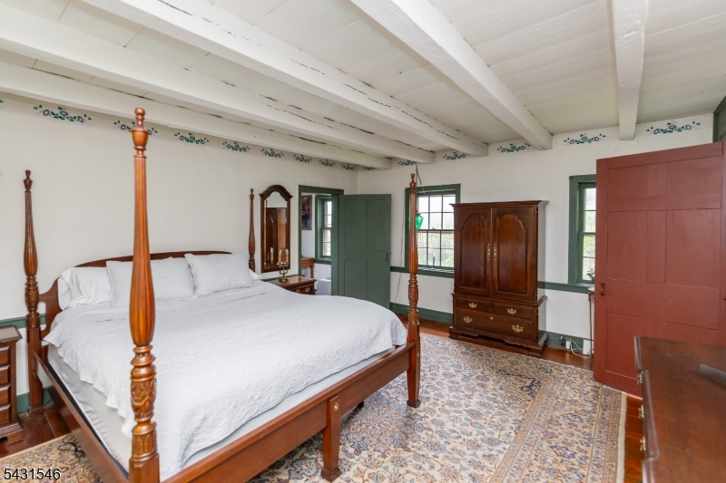 490 Mine Road Asbury, NJ 08802 - Photo 23 of 39 a bed room with a bed and a television