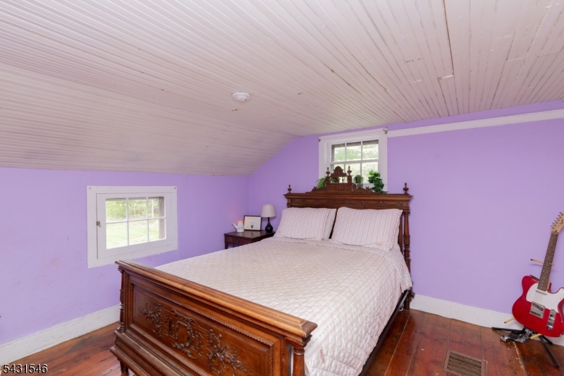490 Mine Road Asbury, NJ 08802 - Photo 29 of 39 a bedroom with a bed and a window