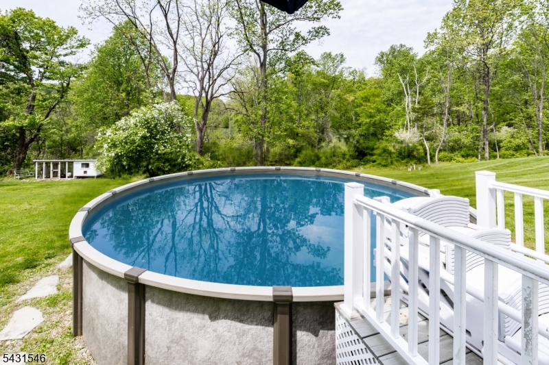 490 Mine Road Asbury, NJ 08802 - Photo 35 of 39 a view of a swimming pool with a yard