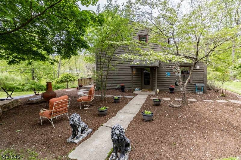 490 Mine Road Asbury, NJ 08802 - Photo 5 of 39 a backyard of a house with outdoor seating