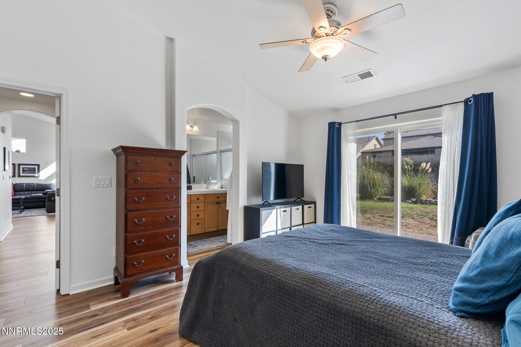 10320 Rosemount Drive Reno, NV 89521 - Photo 15 of 27 a bedroom with a bed and a flat tv screen