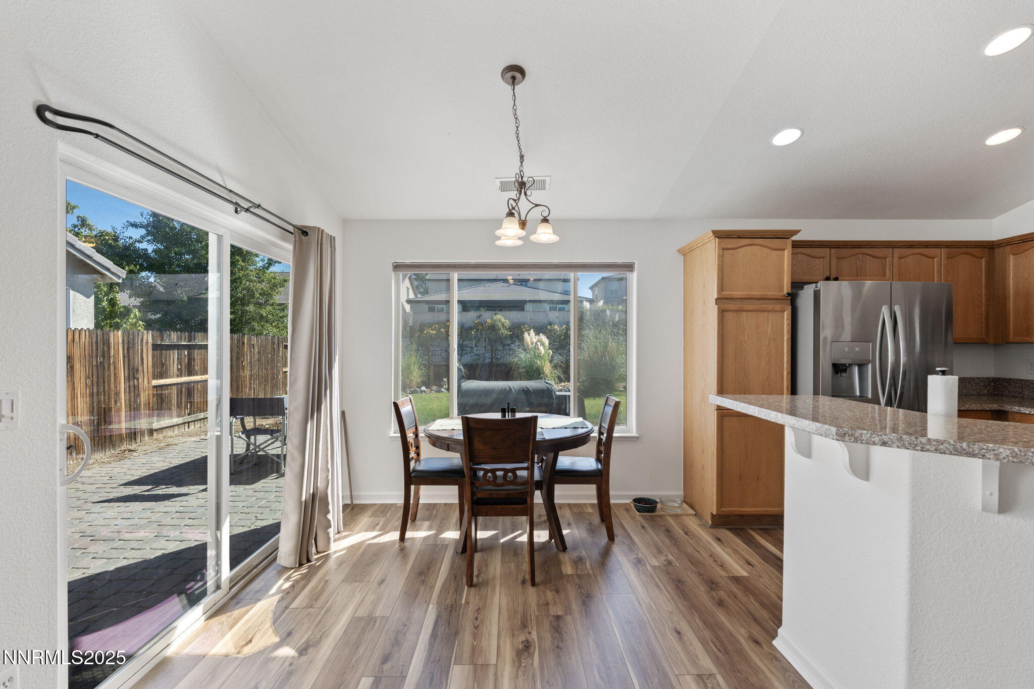 10320 Rosemount Drive Reno, NV 89521 - Photo 8 of 27 a view of a dining room with furniture window and wooden floor
