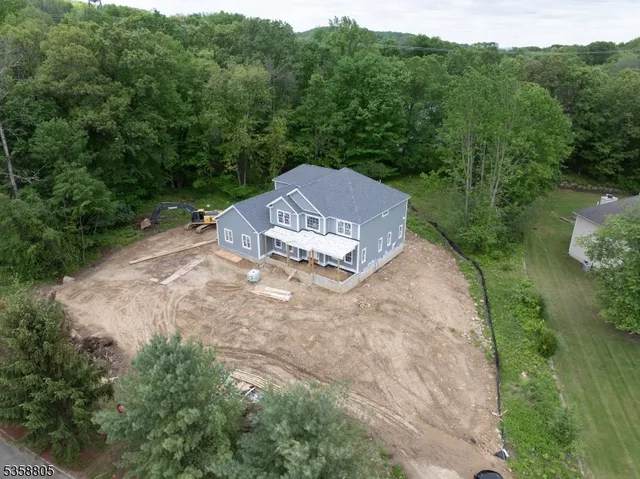 an aerial view of a house with mountain view