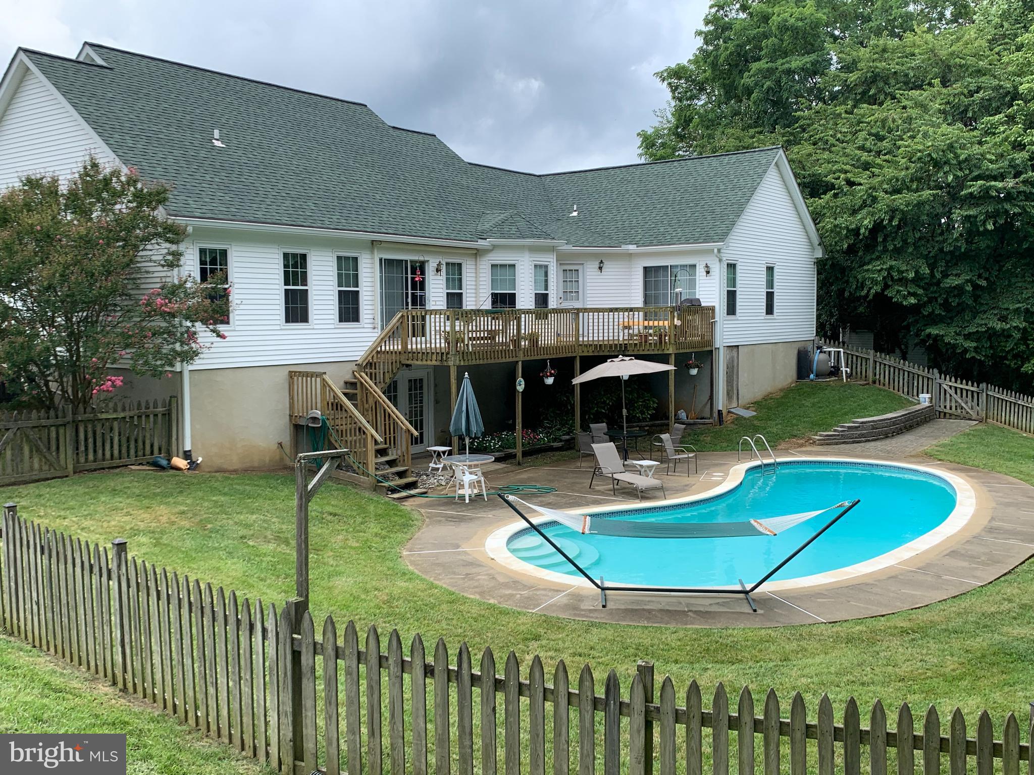 4650 Paul Hance Road Huntingtown, MD 20639 - Photo 10 of 57 a view of a house with backyard swimming pool and sitting area
