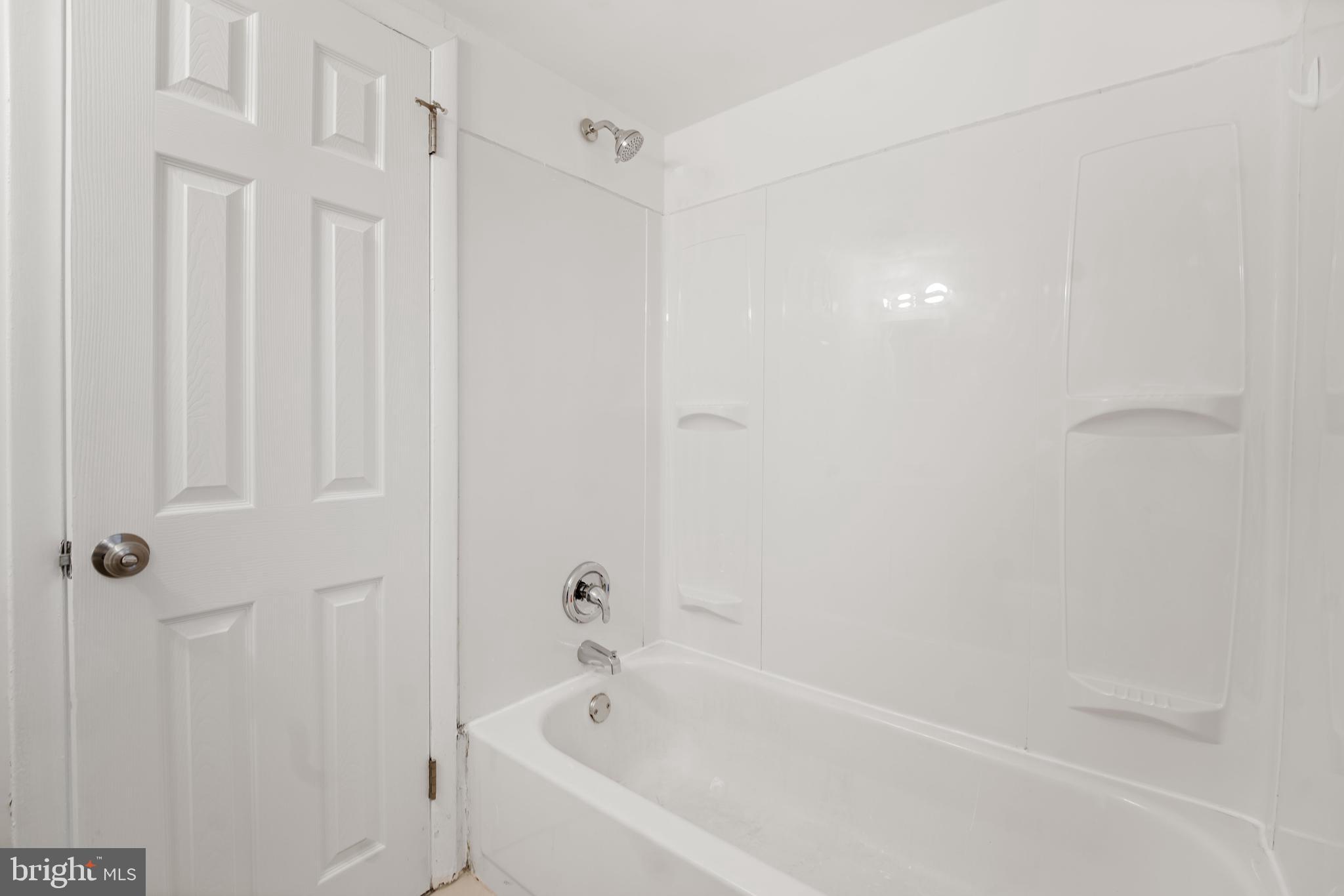 856 Putnam Boulevard, Unit 67A Wallingford, PA 19086 - Photo 12 of 26 a white bath tub sitting next to a white sink
