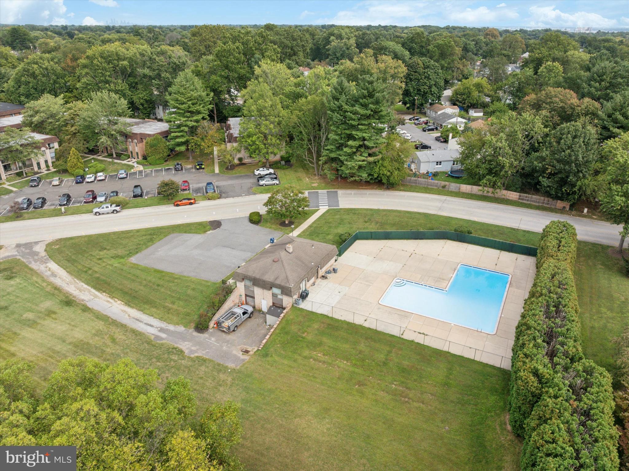 856 Putnam Boulevard, Unit 67A Wallingford, PA 19086 - Photo 21 of 26 a view of a swimming pool with a yard
