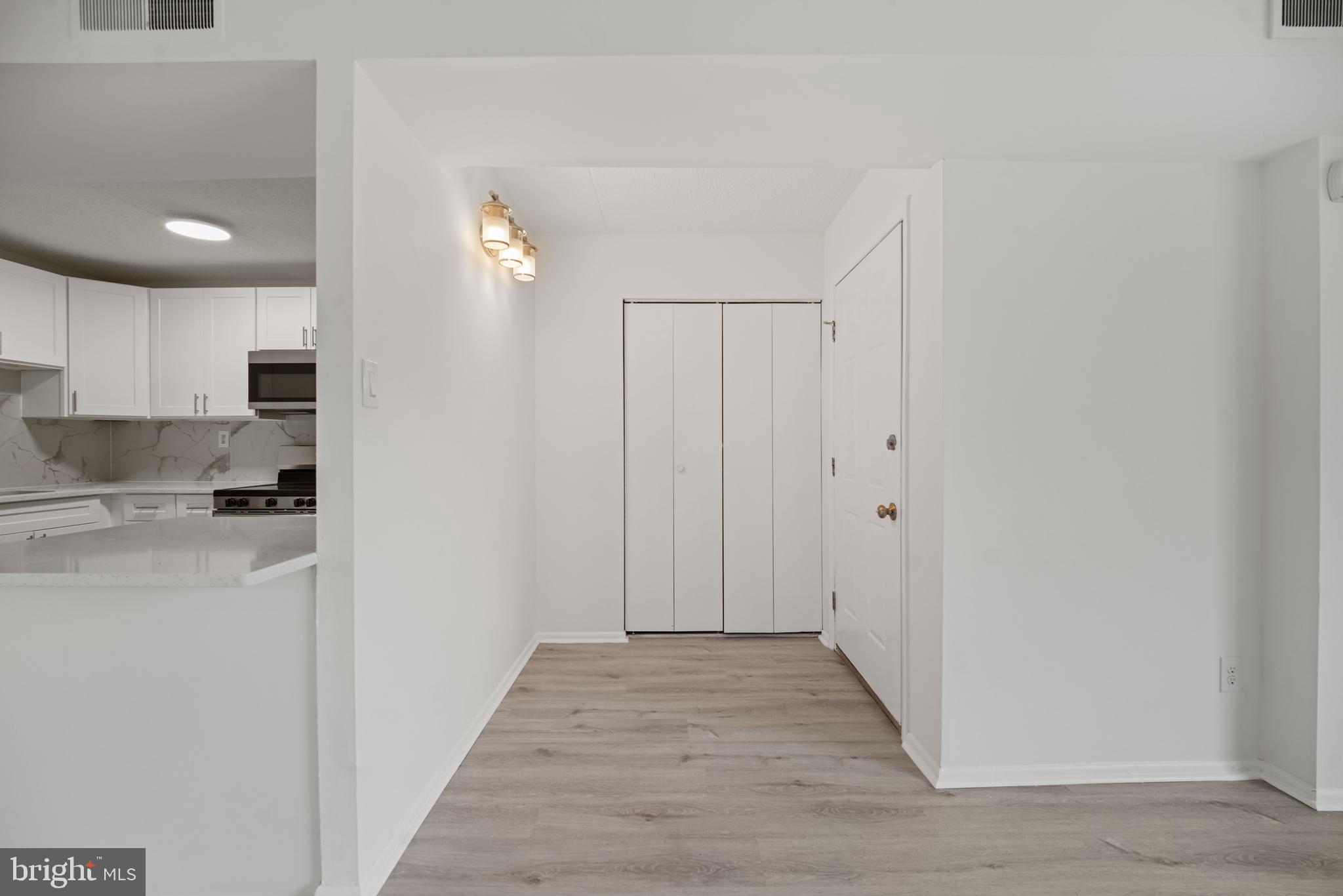 856 Putnam Boulevard, Unit 67A Wallingford, PA 19086 - Photo 6 of 26 a view of a kitchen with wooden floor