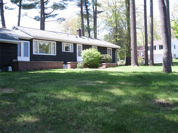 155 Brittany Road Springfield, MA 01151 - Photo 13 of 14 a front view of a house with a yard and trees