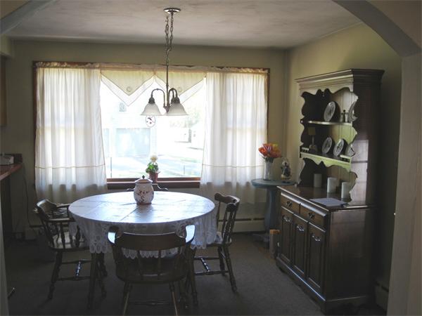 155 Brittany Road Springfield, MA 01151 - Photo 3 of 14 a kitchen with a dining table and chairs