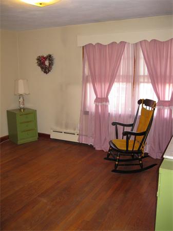 155 Brittany Road Springfield, MA 01151 - Photo 5 of 14 a view of a room with gym equipment and windows