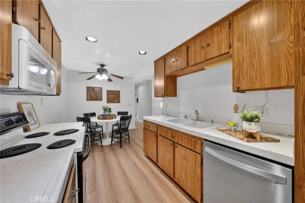 a kitchen with a sink stove and cabinets
