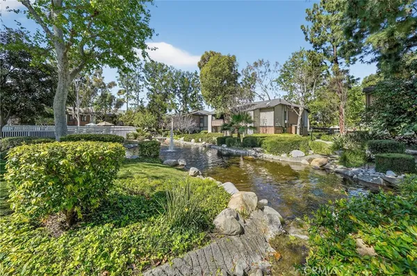 a view of backyard of house with green space