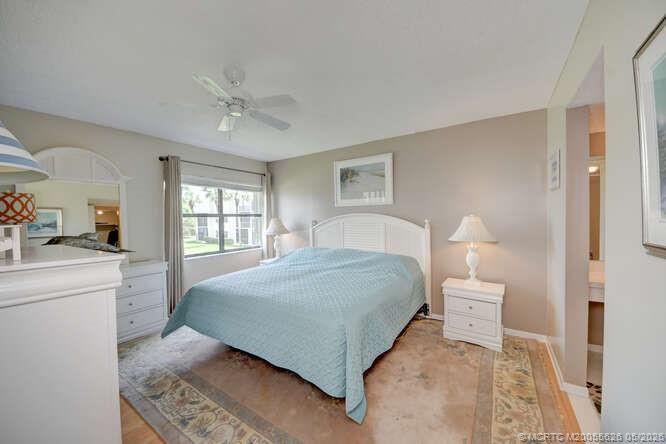 1950 Southwest Palm City Road, Unit 3209 Stuart, FL 34994 - Photo 22 of 64 Spacious primary bedroom.