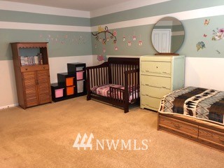 3032 Eagle Loop Northeast Lacey, WA 98516 - Photo 15 of 23 a bedroom with a bed and window