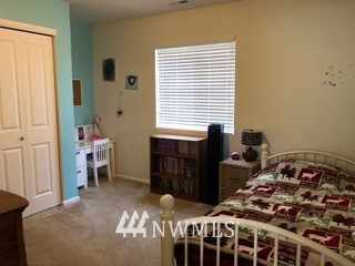3032 Eagle Loop Northeast Lacey, WA 98516 - Photo 16 of 23 a bedroom with a bed and a window