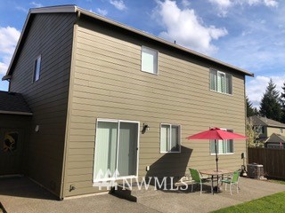 3032 Eagle Loop Northeast Lacey, WA 98516 - Photo 20 of 23 a front view of a house with patio