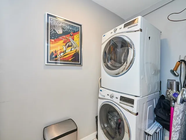 a living room with dining room and wooden floor