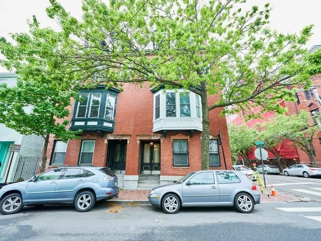a car parked in front of a house