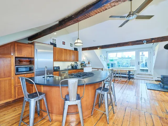 a kitchen with a stove and a sink