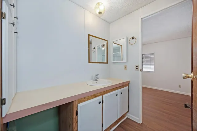 a view of entryway livingroom and hall with wooden floor
