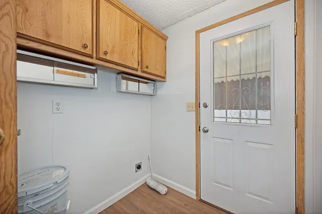 a view of a brick building with many windows